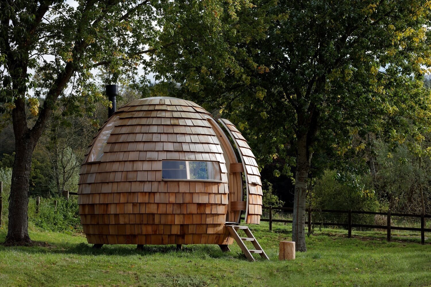 the escape pod is a cedar clad acorn shaped retreat by burke design and architecture